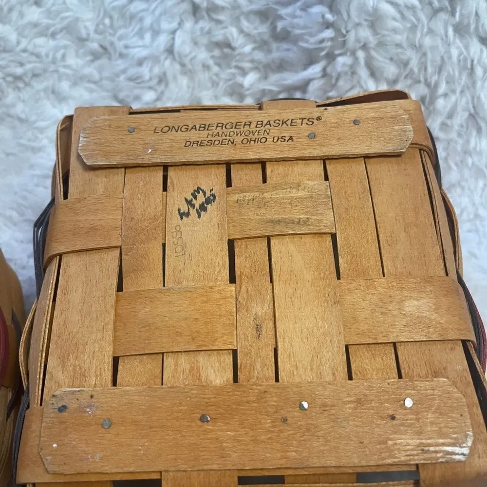 Longaberger 1995 set of two Handcrafted round and Square Woven baskets .